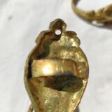 Old curtain kiss in gilded bronze
