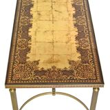 Coffee table in gilded brass