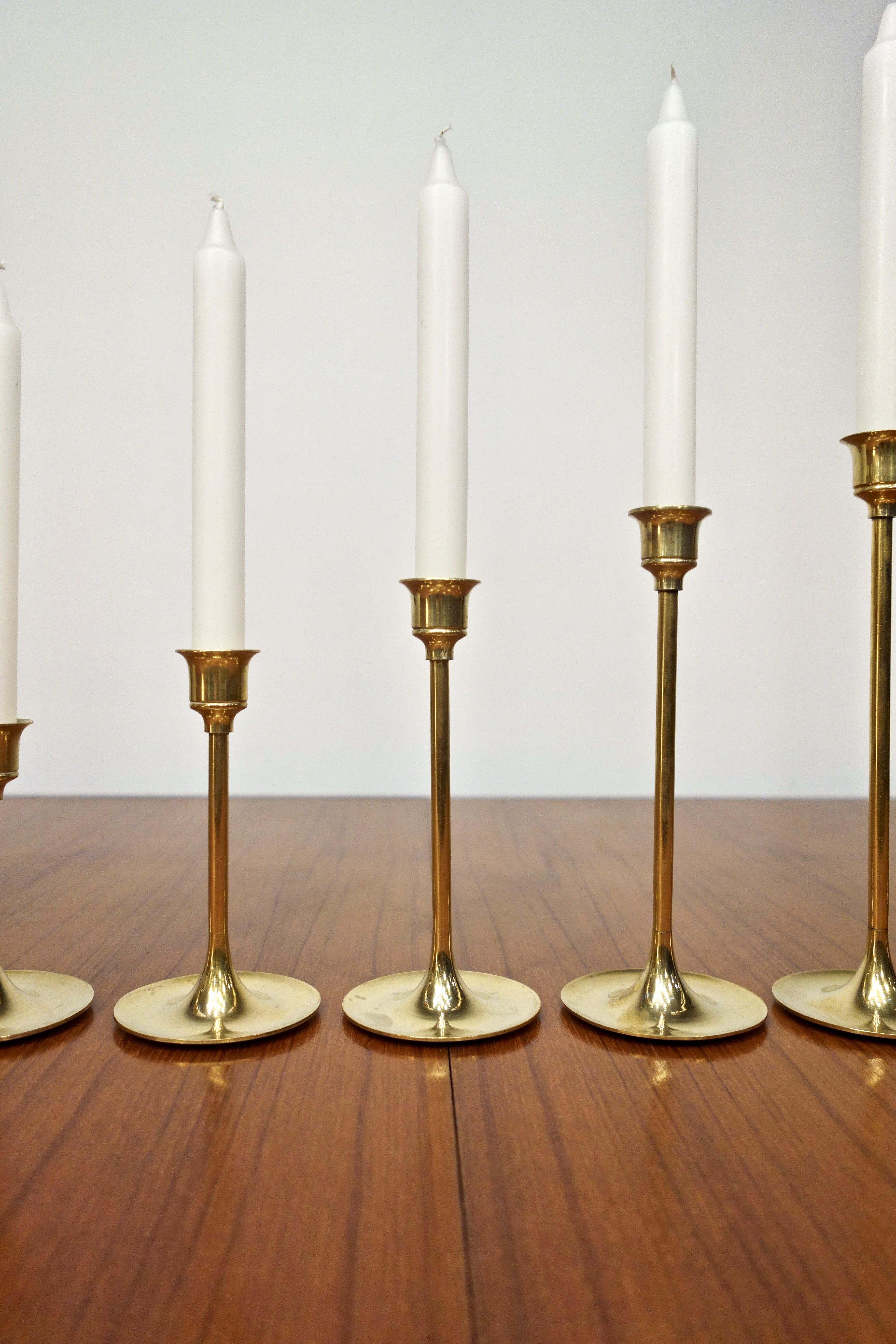Set of 7 Scandinavian brass candle holders, 1960's