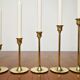 Set of 7 Scandinavian brass candle holders, 1960's