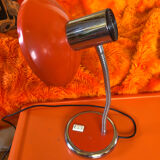 Orange articulated desk lamp