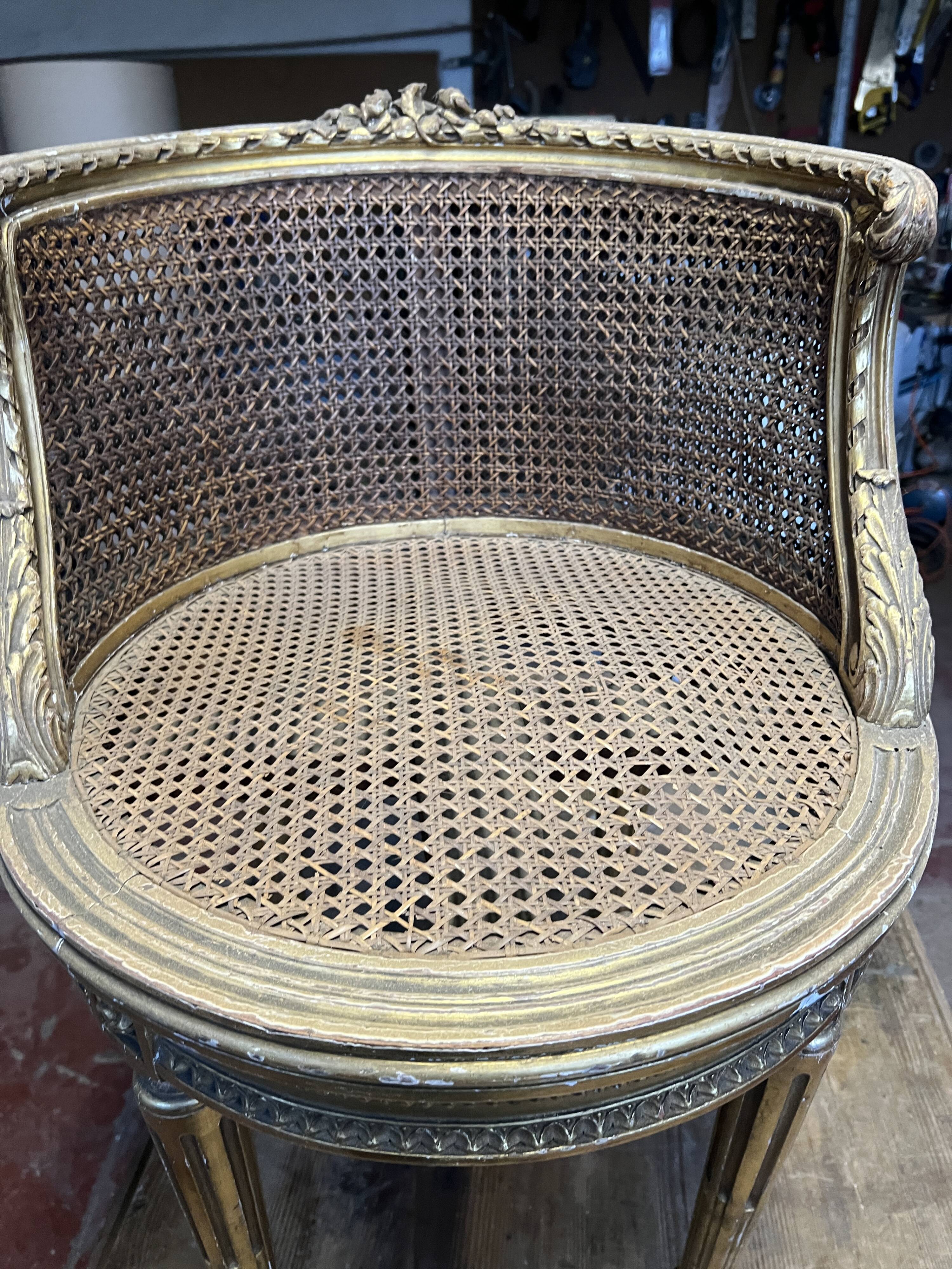 Louis XVI style armchair in wood and gilded stucco, 20th century.