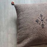 Moroccan brown cushion with cotton pompom