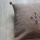 Moroccan brown cushion with cotton pompom