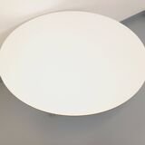 Vintage Eames round table for Vitra in white melamine, wood, and metal.