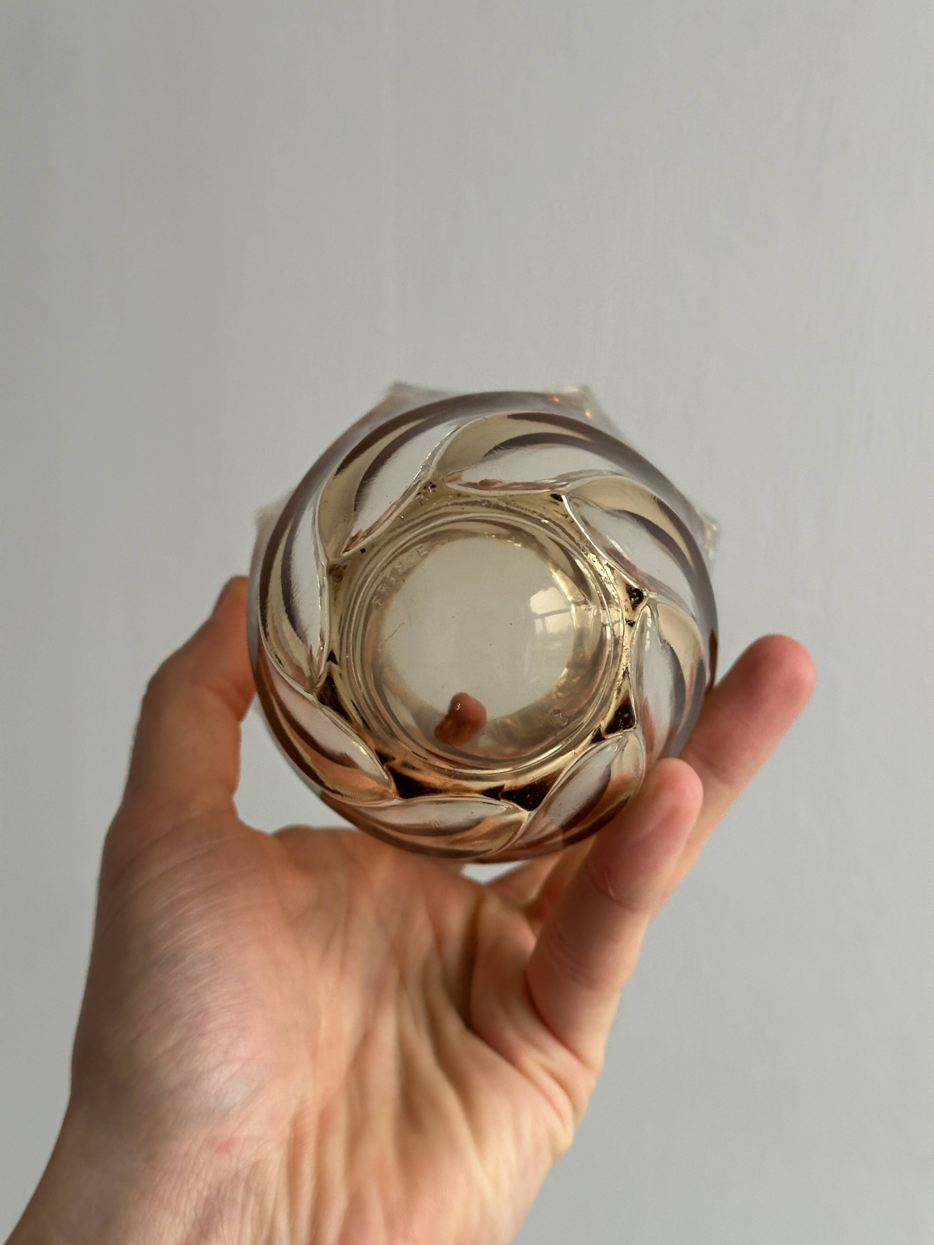 Small translucent pink twisted glass vase