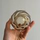 Small translucent pink twisted glass vase