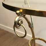Neoclassical style tripod pedestal table in brass and round glass top in the taste of the House