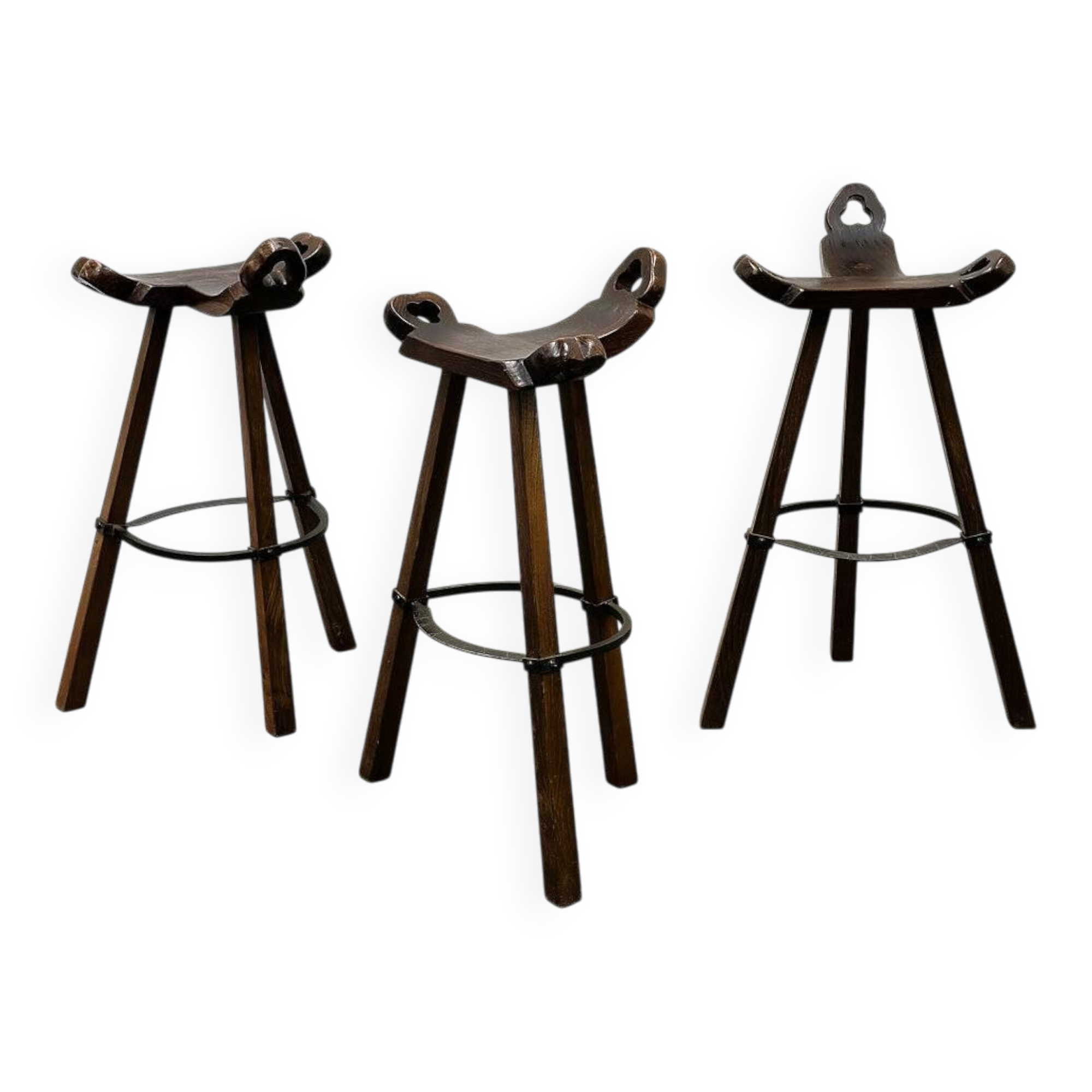 Set of 3 rustic carved oak bar stools with iron footrests, 1970s