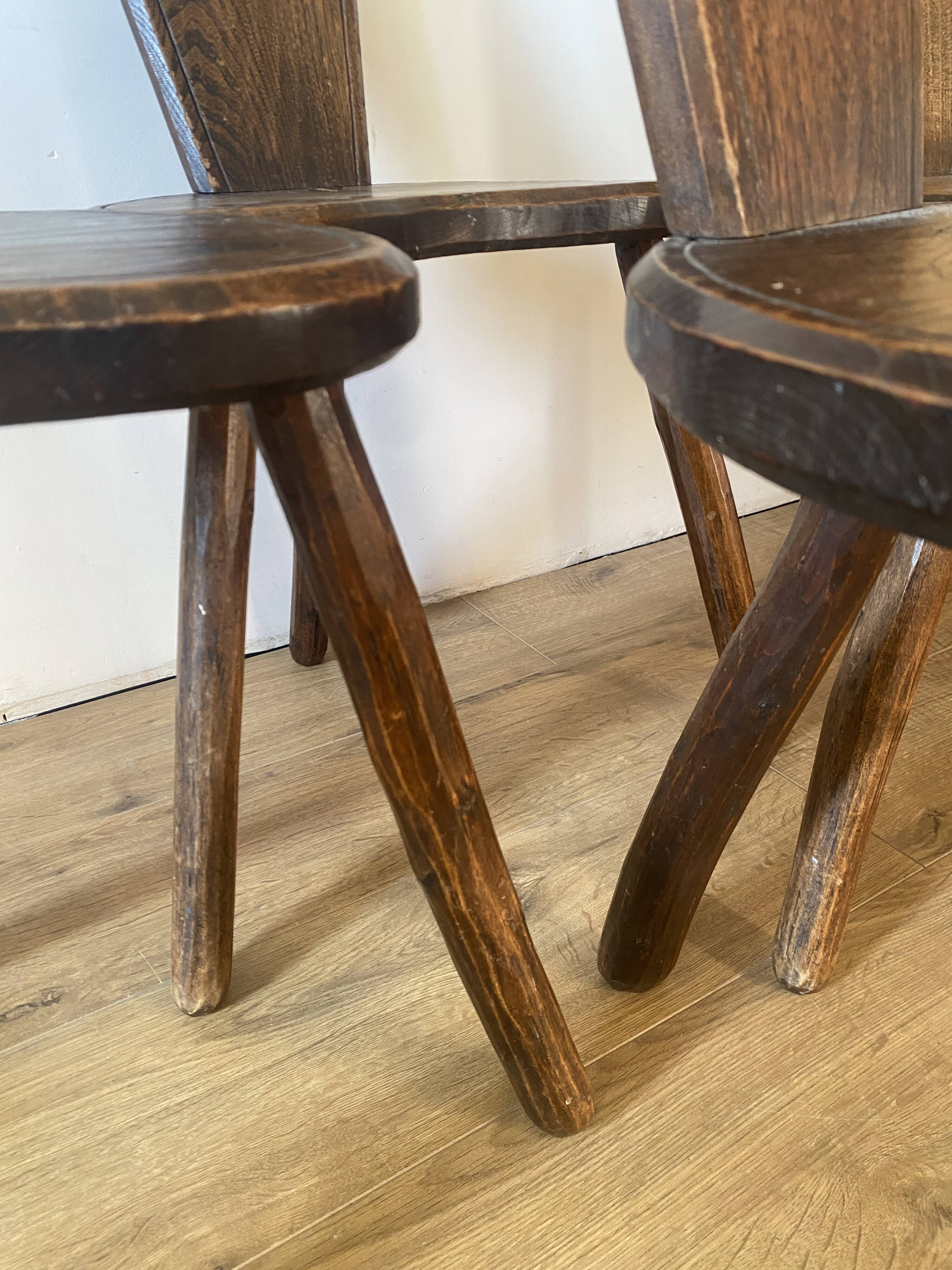 4 brutalist farm tripod chairs