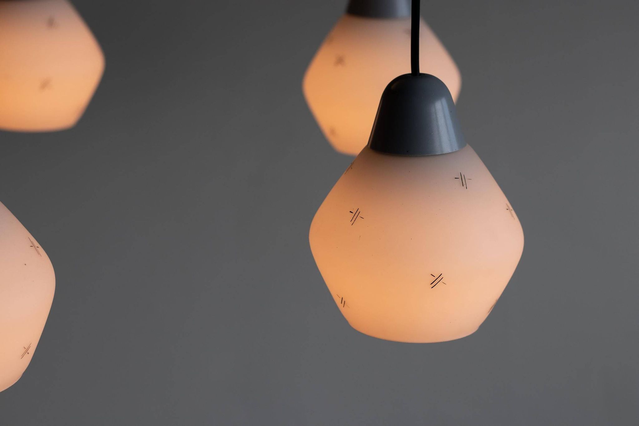 Italian brass enamelled grey chandelier with frosted glass pendants, circa 1960.