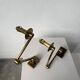Pair of brass wall lights with articulated arms from the 70s