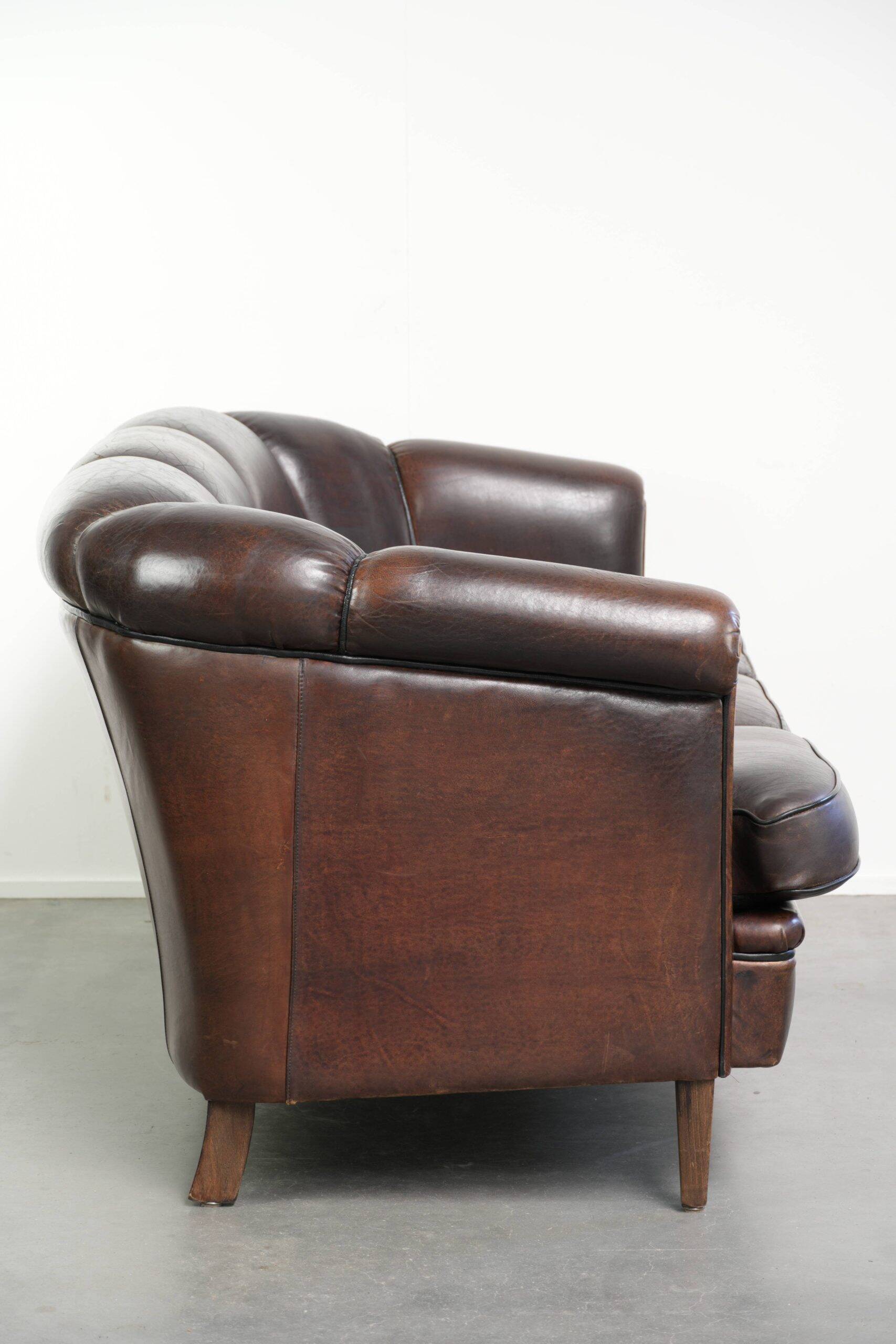 Unique sheepskin 3-seater sofa with deep colours and a distinctive design