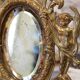 Miroir en bronze à décor d'angelots et mascarons fin 19ème siècle