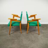Pair of wood and vinyl armchairs