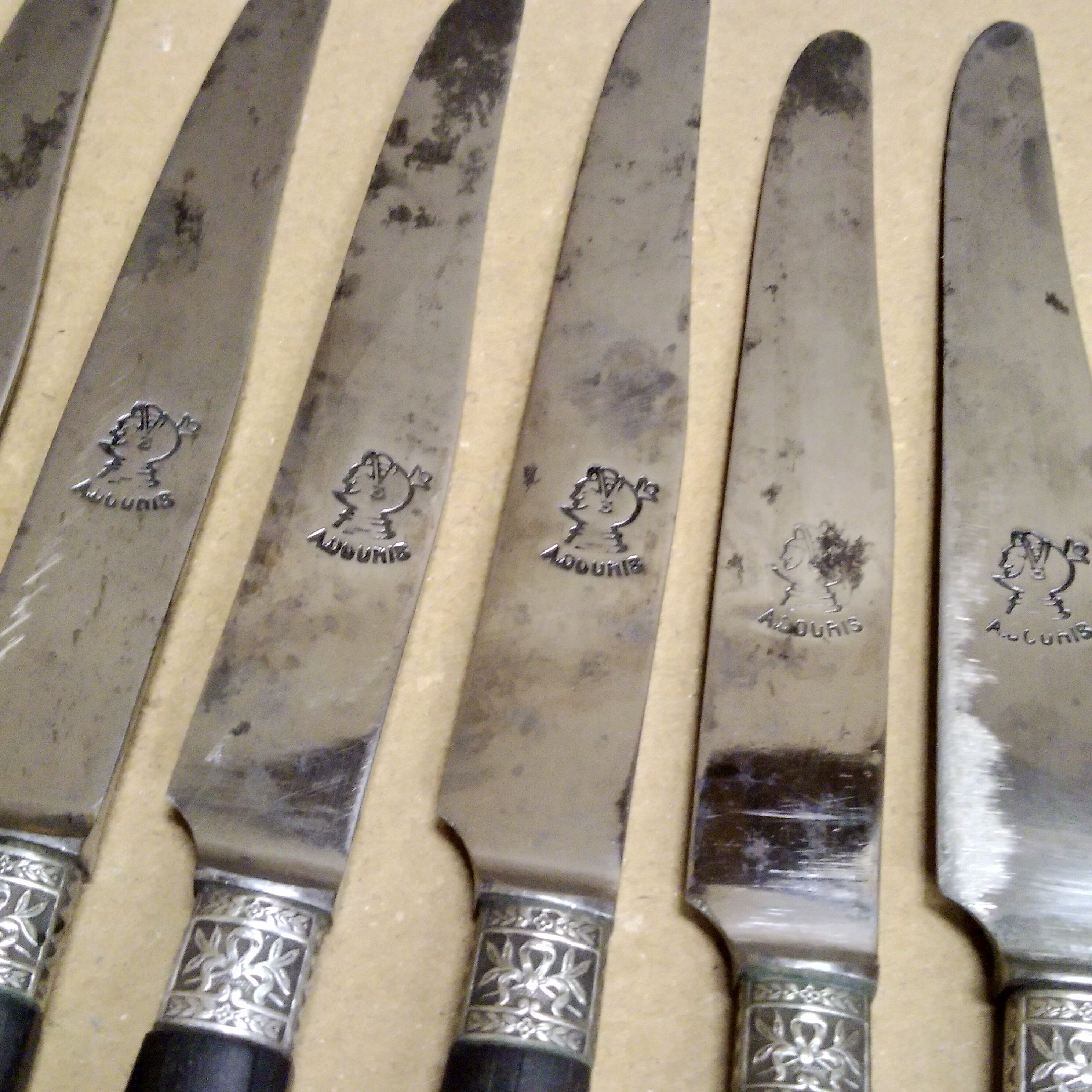 12 Silver dessert knives, ebony, steel, late 19th century