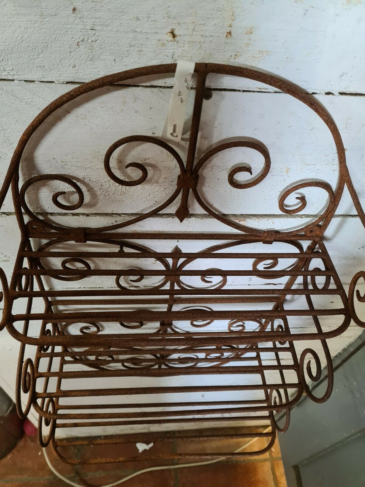 Wrought iron wall shelf