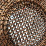 Wall composition of seven baskets and wicker trays.