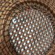 Wall composition of seven baskets and wicker trays.