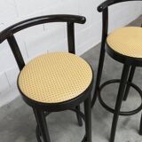 Pair of Baumann Dialog model stools in black and yellow and blue imitation leather, 1990
