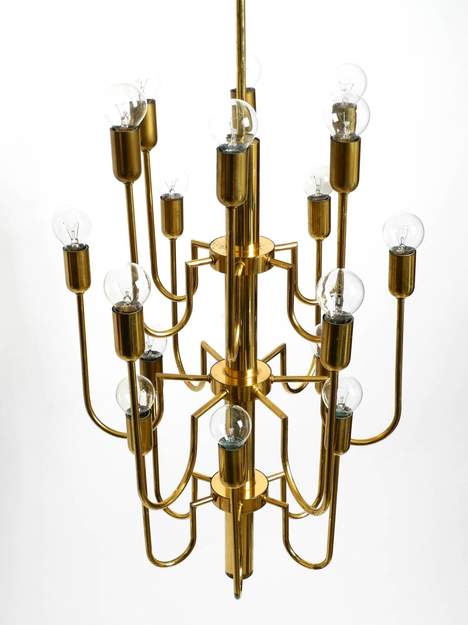 Three staged 18 arm Mid Century brass chandelier with a long brass rod
