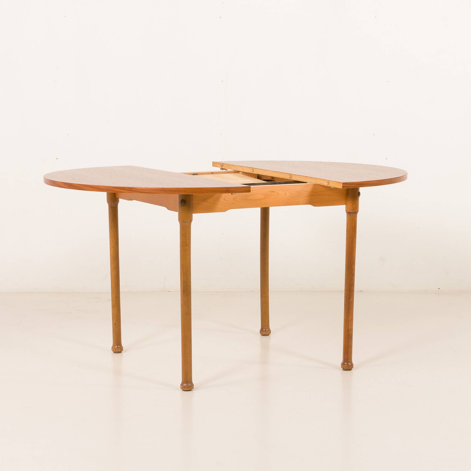 Teak round table with hidden extension, 1970s
