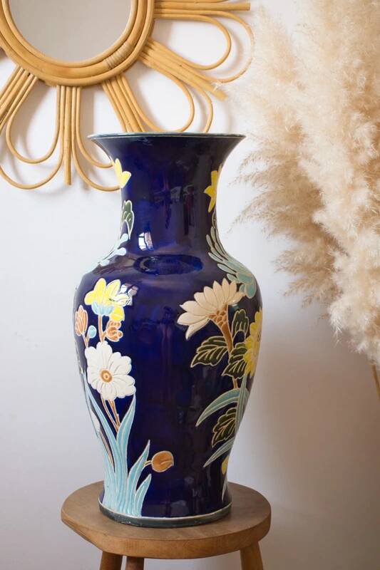 Large vintage vase with a floral relief motif.