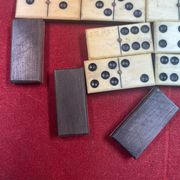 Set of complete dominoes made of bone, nails and blackened wood