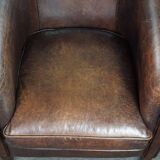 Dark sheep leather club armchair, sleek design