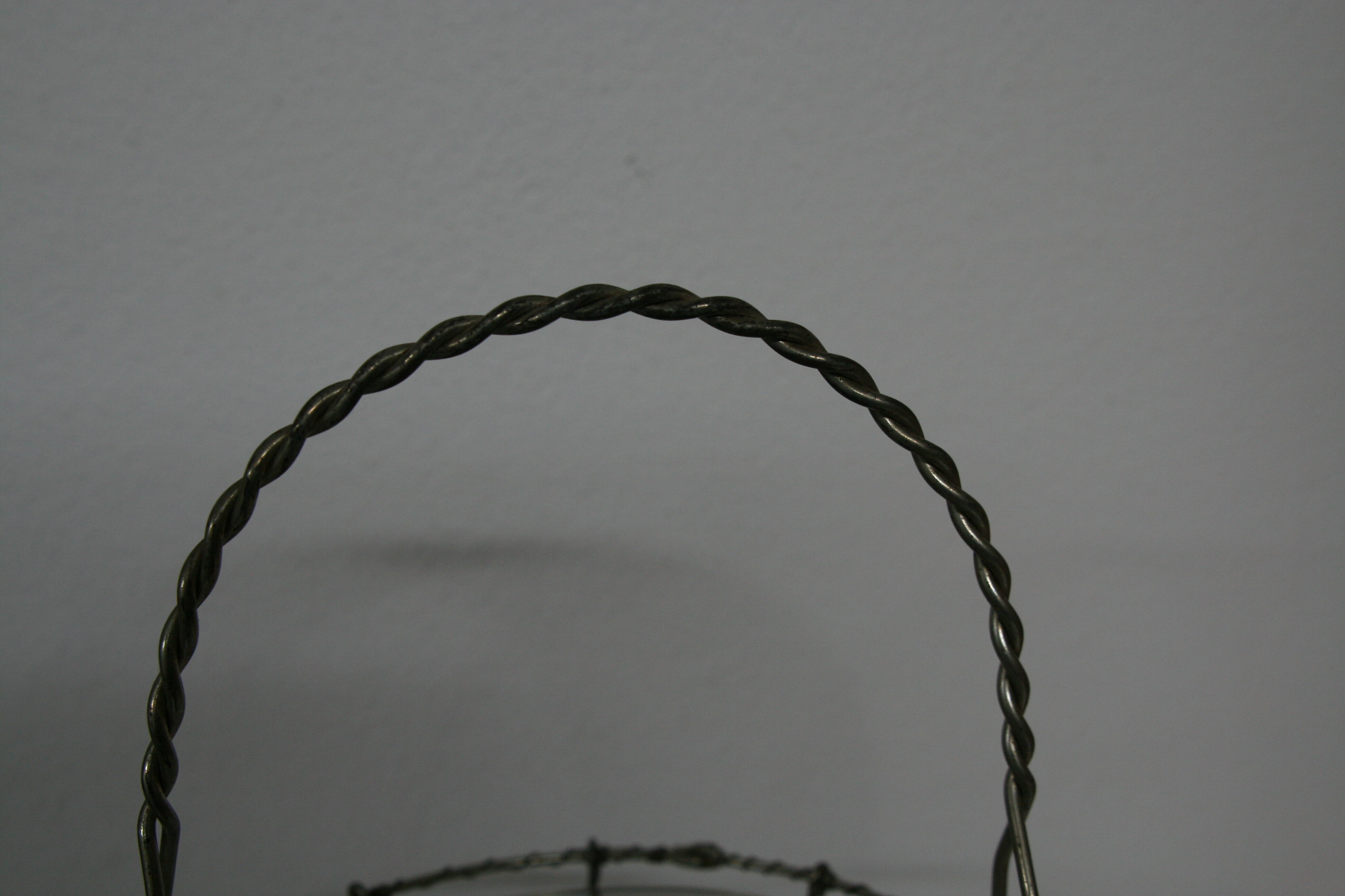 Egg basket in braided metal