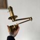 Pair of brass wall lights with articulated arms from the 70s
