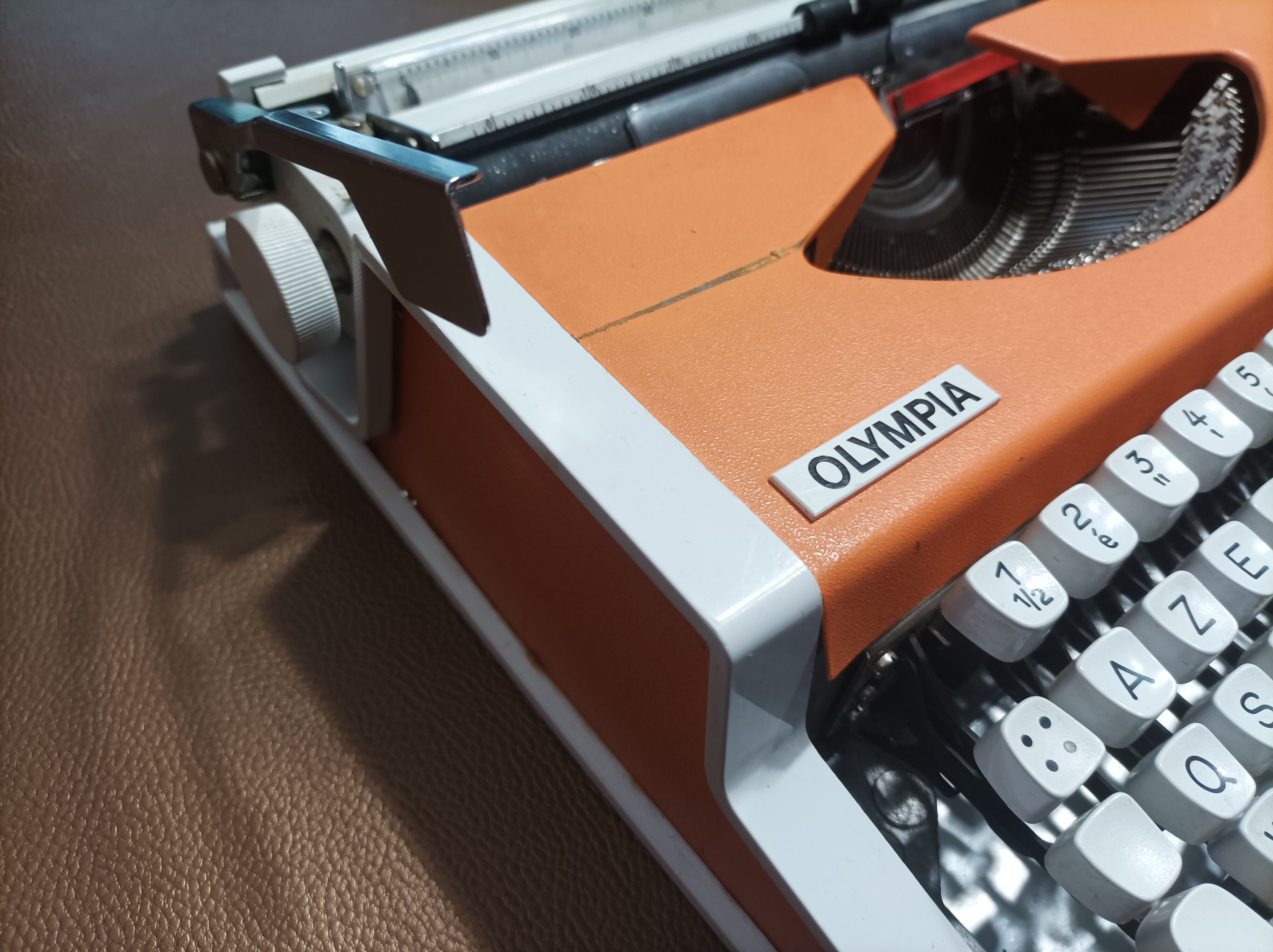 Olympia traveller luxury typewriter orange revised and new ribbon