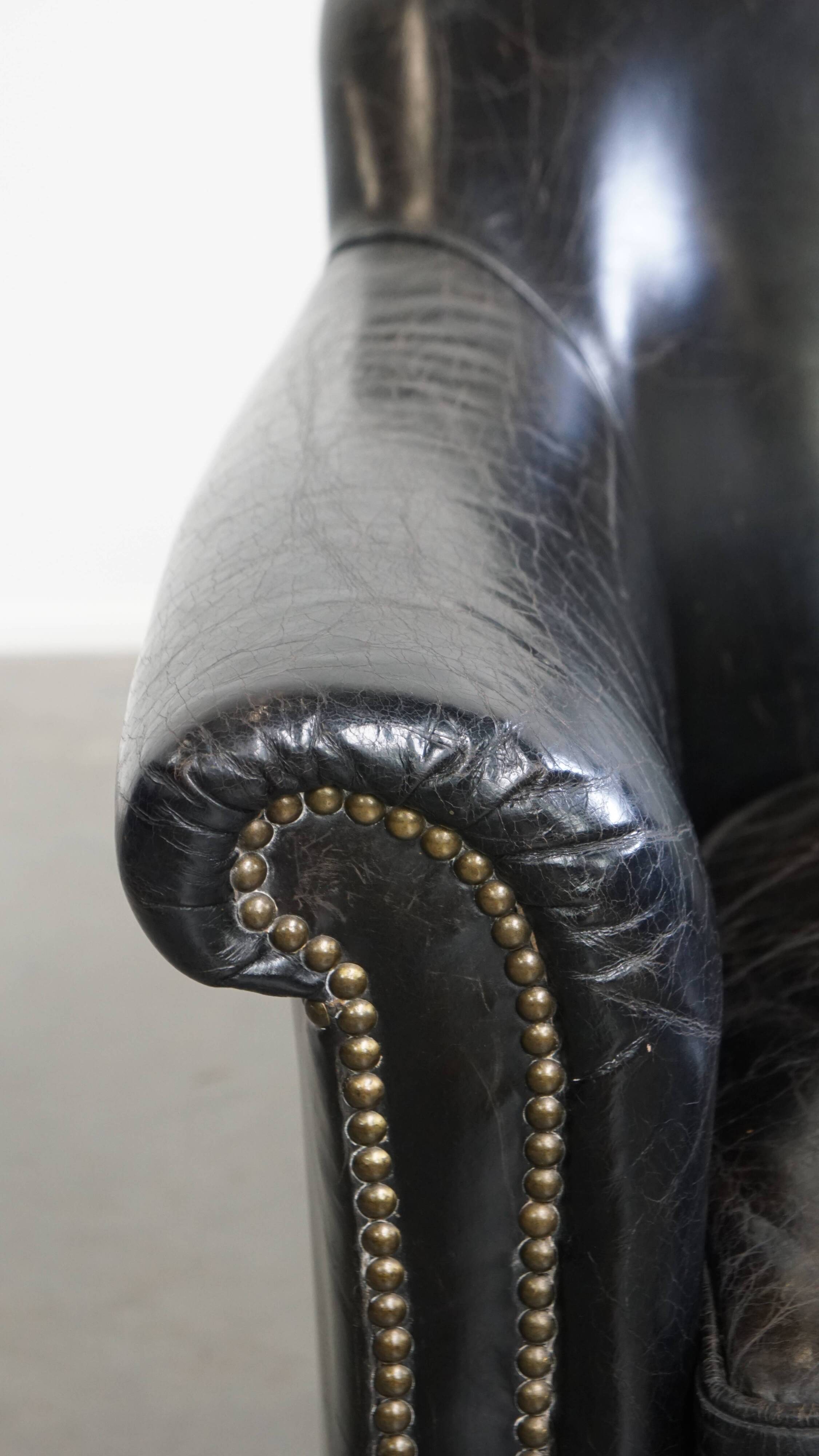 Black cowhide leather armchair