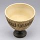 Vintage ceramic pedestal bowl – textured black and beige decor