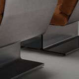 Very rare pair of leather and steel lounge chairs by Paul Geoffroy for Uginox