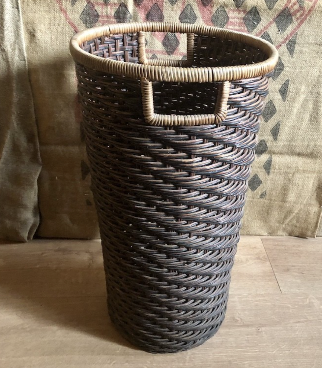 High basket in braided wicker