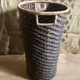 High basket in braided wicker