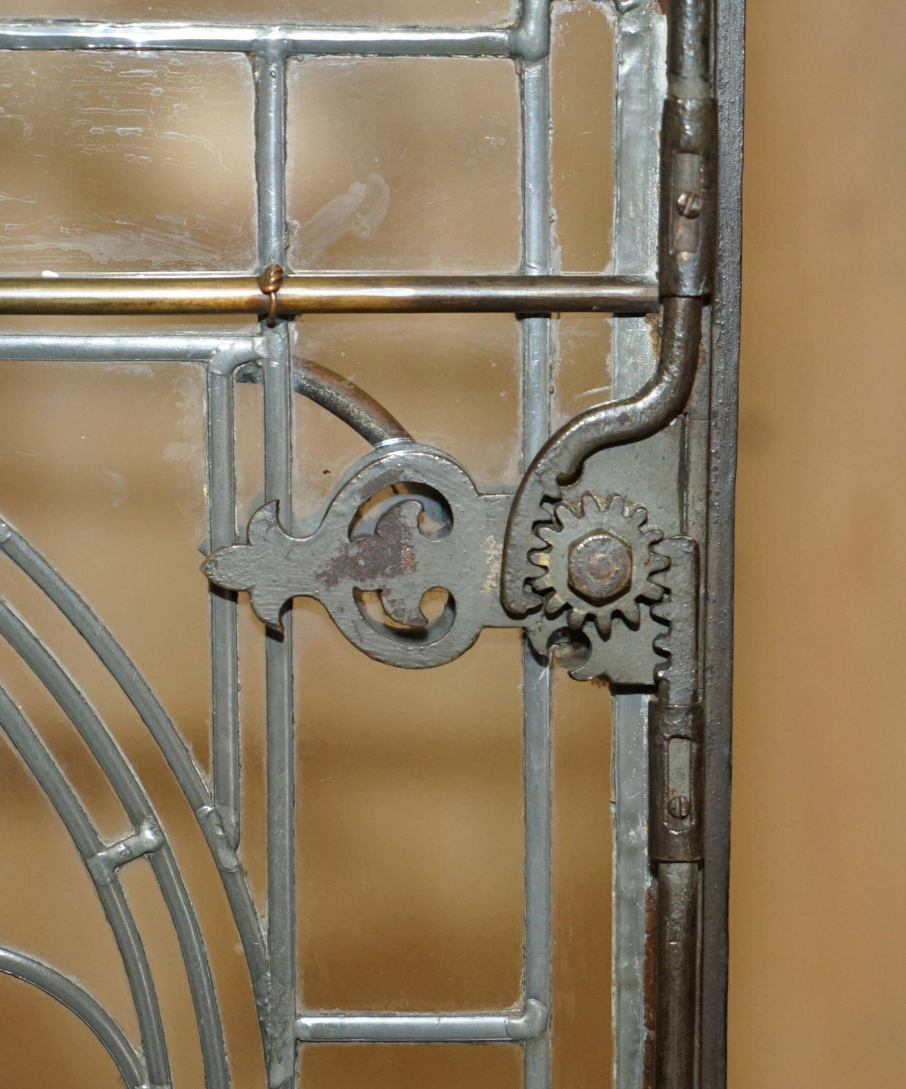 Jacobean hardwood library with carved panels and glass doors.