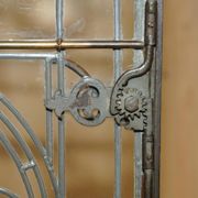 Jacobean hardwood library with carved panels and glass doors.