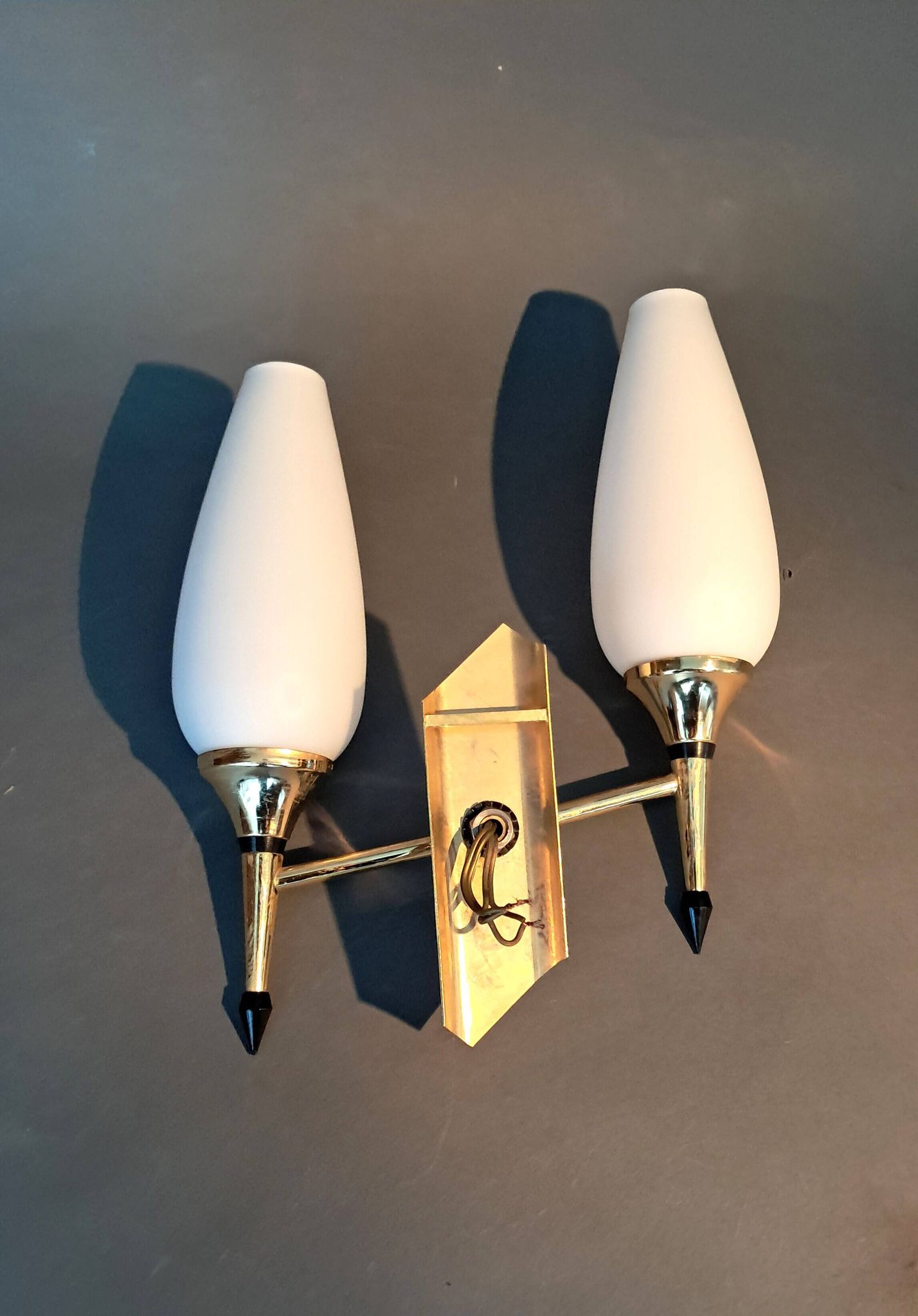 Small two-light wall lamp, white opaline and gilded brass, Circa 1960.
