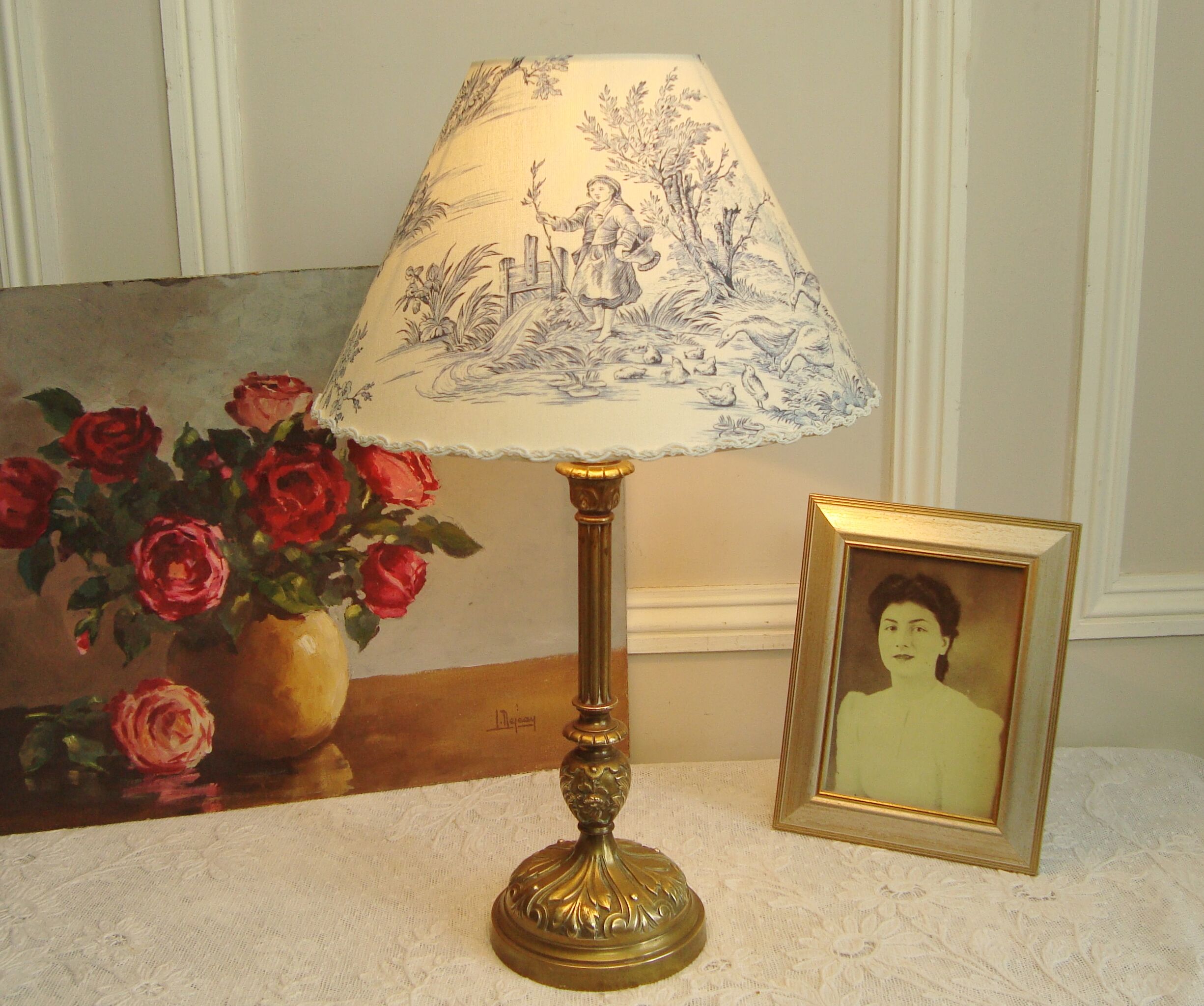 Ancient bronze lamp with its blue Jouy canvas lampshade