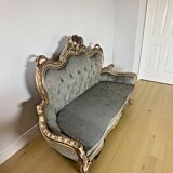 A soft light blue and silver tufted beech wood sofa in Louis style.