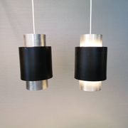 A set of beautiful cylinder shaped hanging lamps in silver color with black "ring" Danish 1970s.