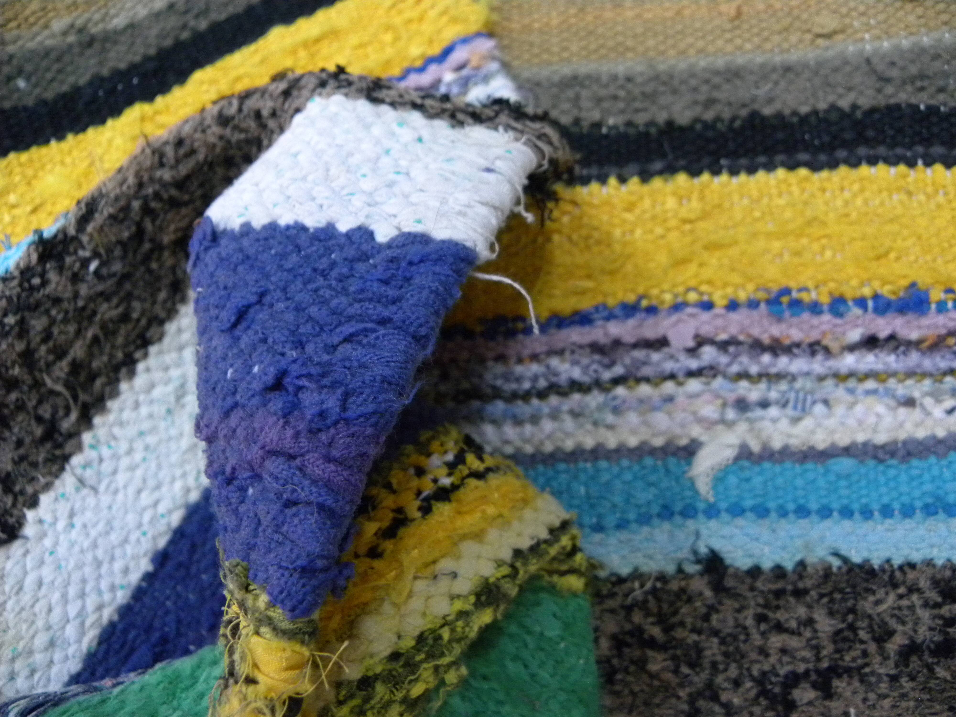 Vintage traditional nomadic kilim ethnic rug with multicoloured stripes.