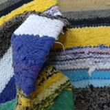 Vintage traditional nomadic kilim ethnic rug with multicoloured stripes.