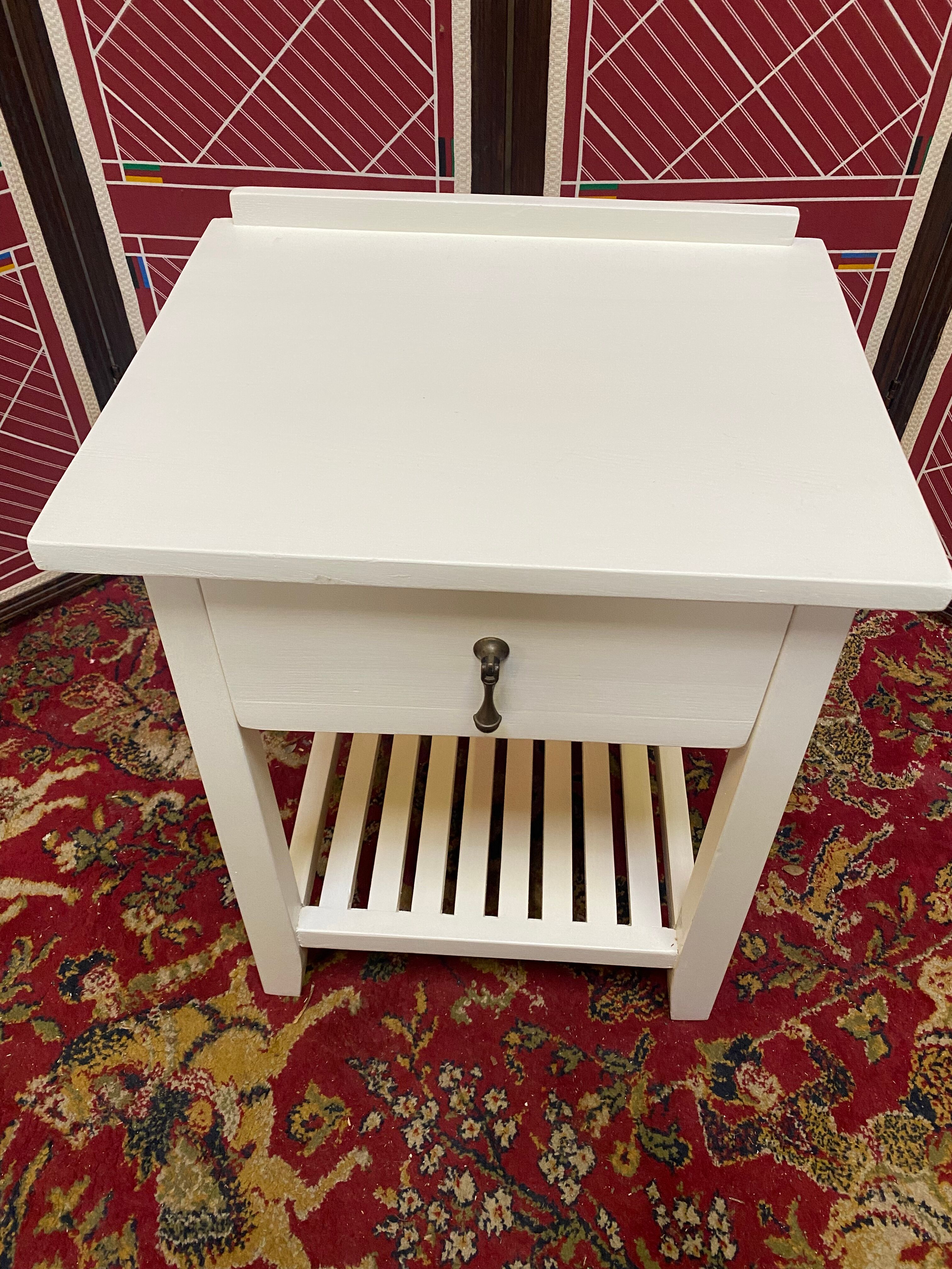 Wooden bedside table painted white