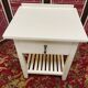 Wooden bedside table painted white