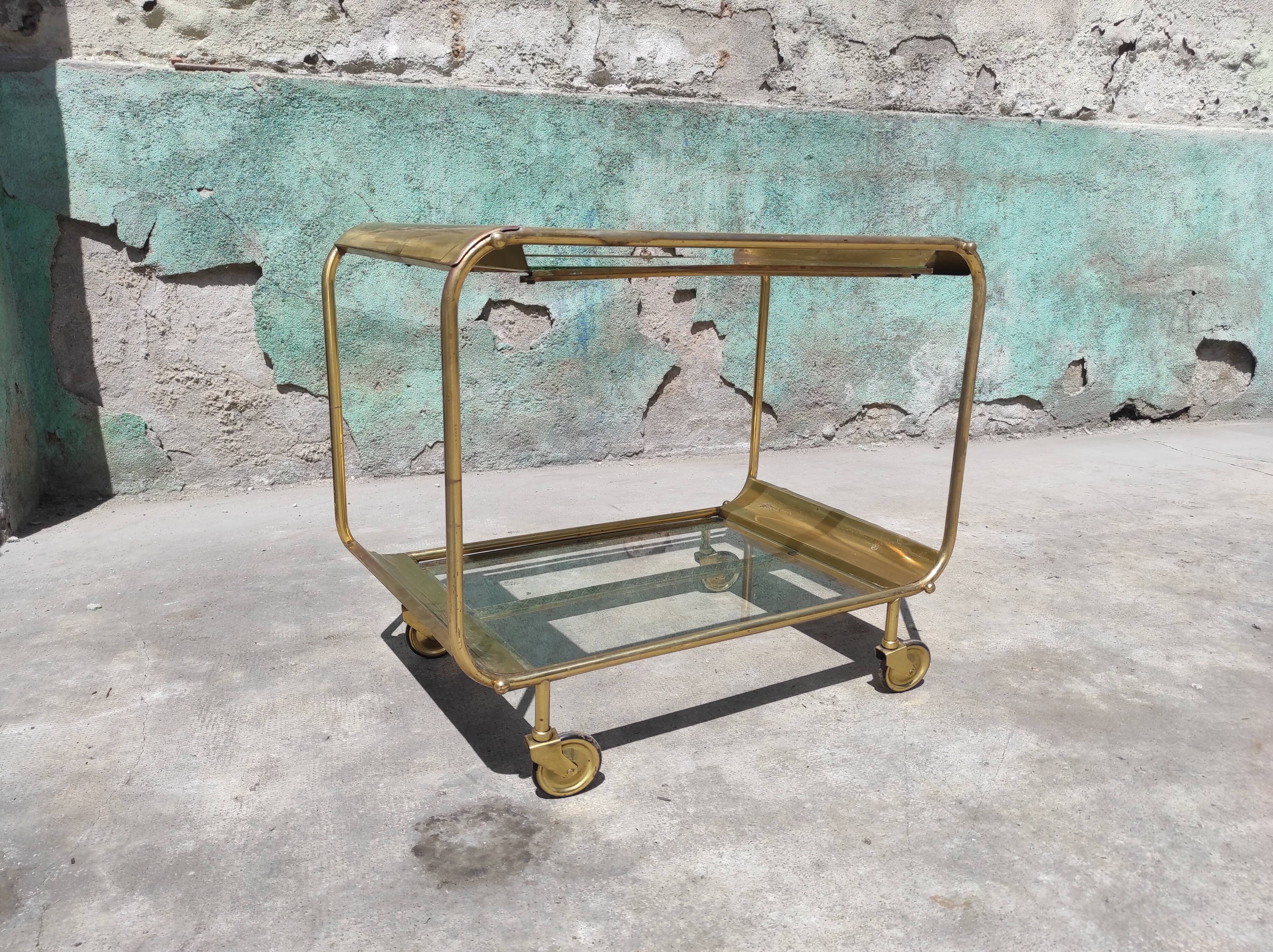 Old rolling coffee table serving vintage brass bar 50s mid-century design