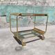 Old rolling coffee table serving vintage brass bar 50s mid-century design