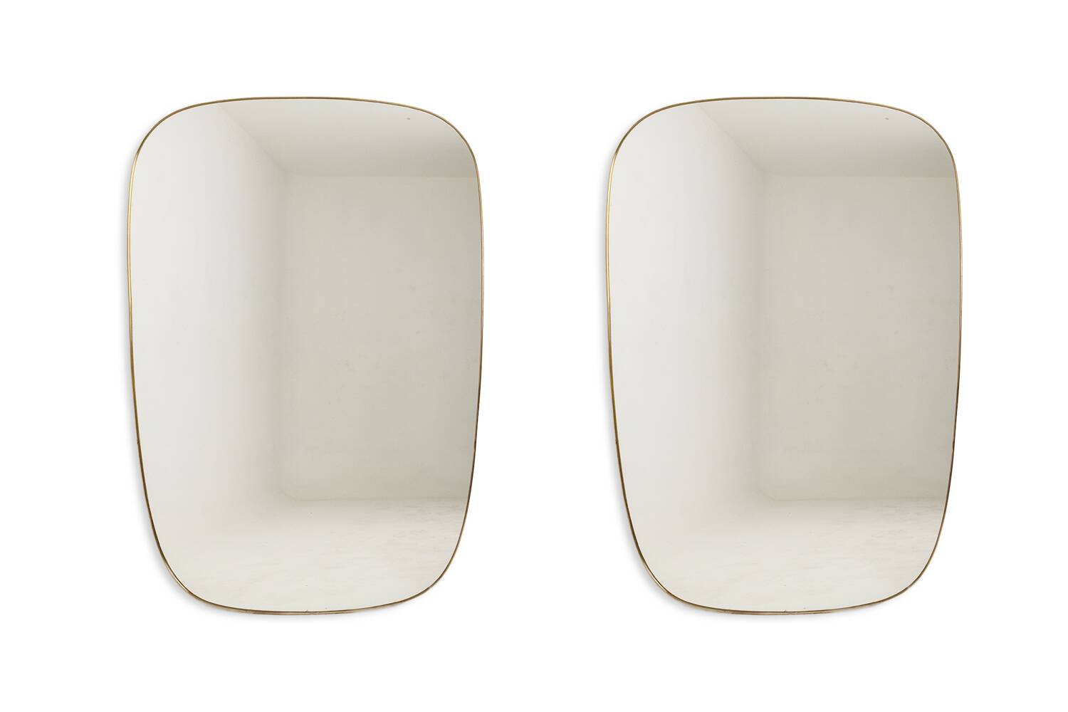 Gio Ponto, in the style of. Pair of mirrors framed in gilt brass. 1980s